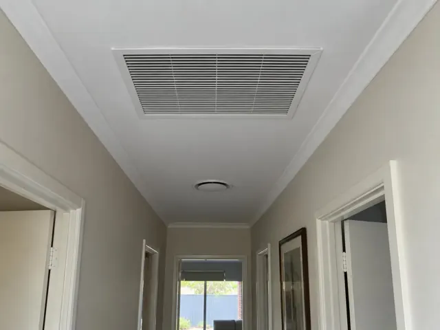 Hallway ceiling with a return-air grille in a home interior in Mawson Lakes